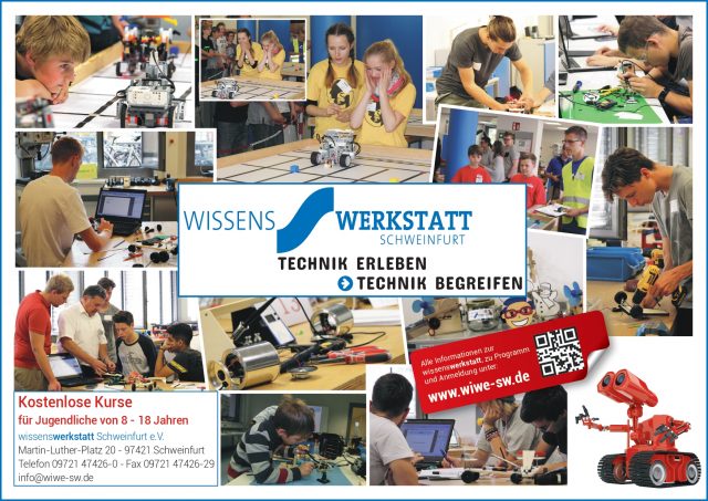Kinder experimentieren mit Technik in einer Werkstatt.